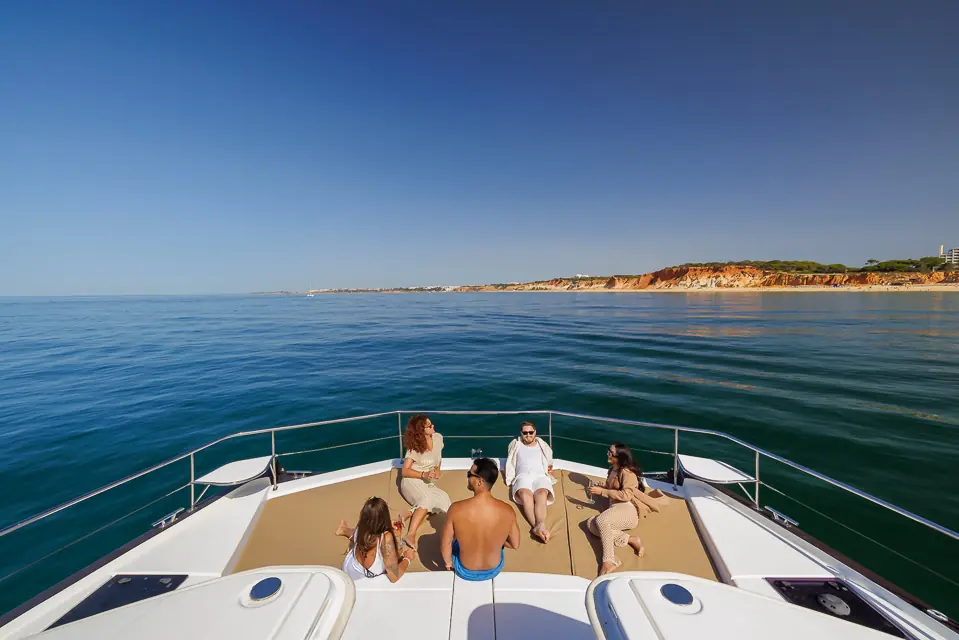 Guests relaxing on the bow sunbeds of Morningstar