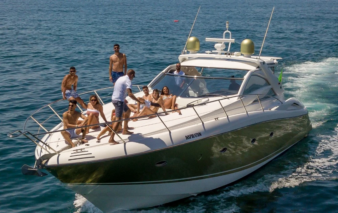 Sunseeker private yacht charter with guests on the sun deck, Albufeira